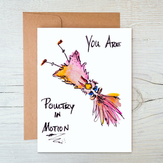 front side hand-drawn, hand-painted card of a colorful, whimsical watercolor upside-down bird with brown kraft envelope behind it with the words "You Are Poultry In Motion" on a background of white-washed wood