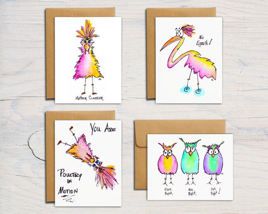 front side of 4 cards, each hand-drawn, hand-painted. One each of the OG Mother Clucker, No Egrets!, You Are Poultry In Motion and Owl Right, Owl Right, Owl Right cards, shown with brown kraft envelope behind them on a background of white-washed wood