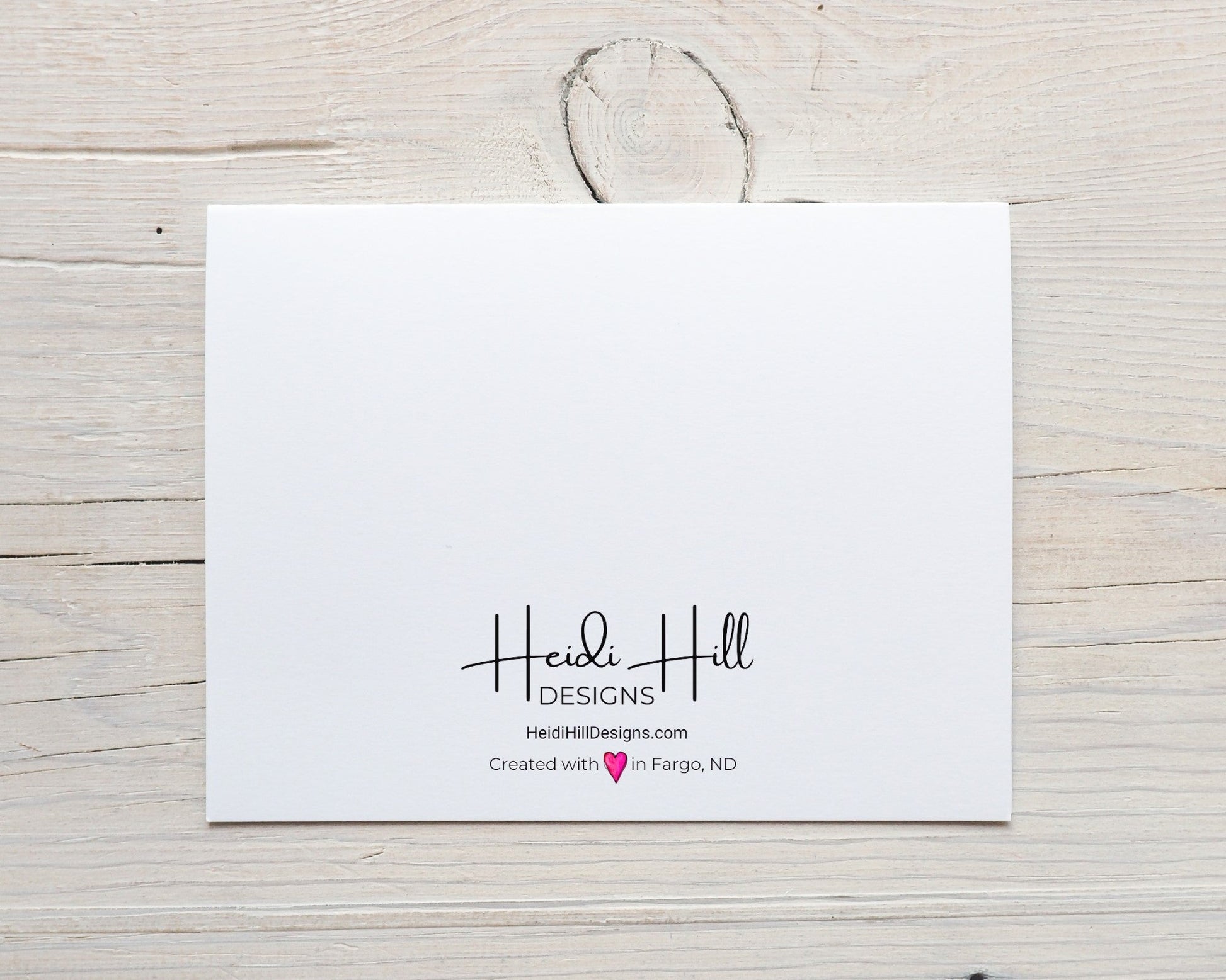 back of card with HeidiHillDesigns.com logo and the phrase "created with (hand-drawn pink heart) love in Fargo, ND"